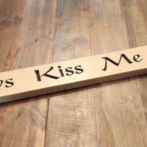 Wooden 'Kiss Me' Sign